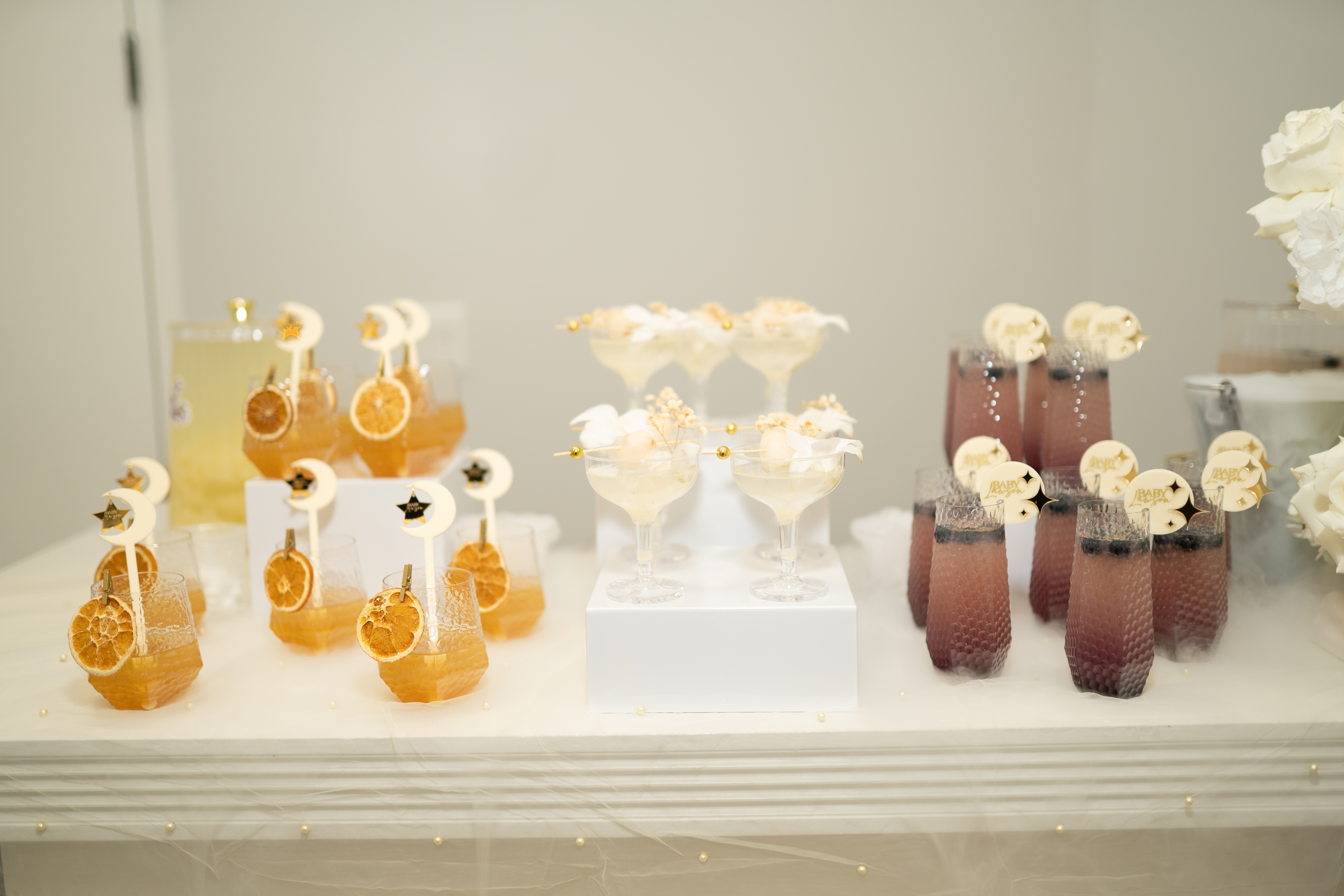 Elegant cocktail display with moon and star garnishes